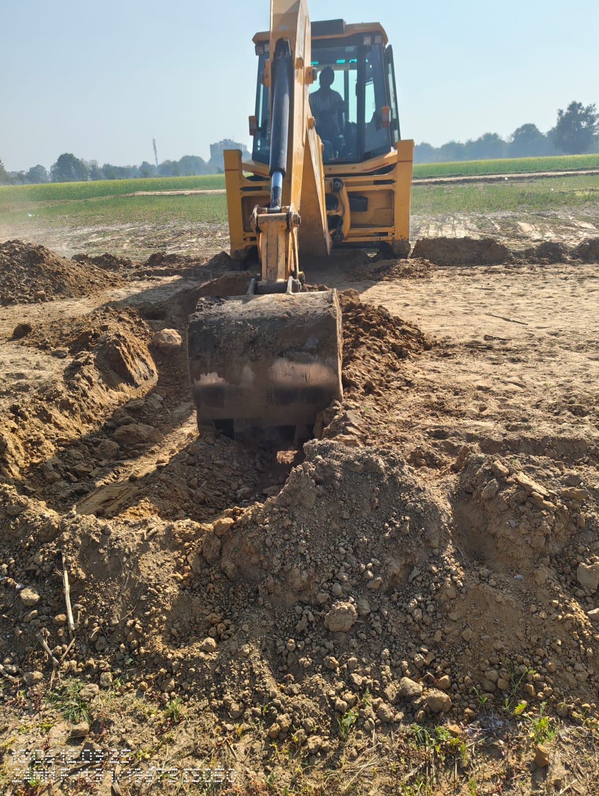 Bulldozers run on a 4-acre illegally developed colony