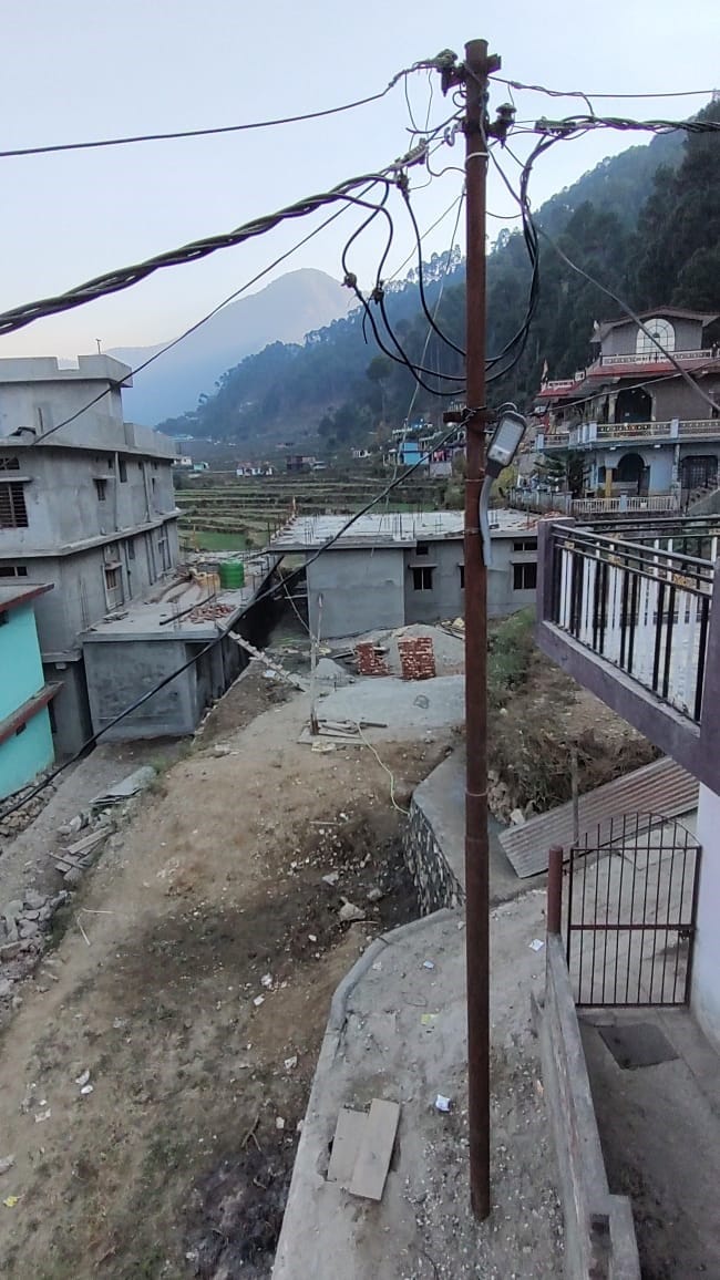 People protested against the installation of an electric pole on the public road.