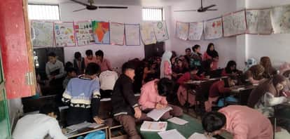 Teachers are busy with their work and children are busy copying.