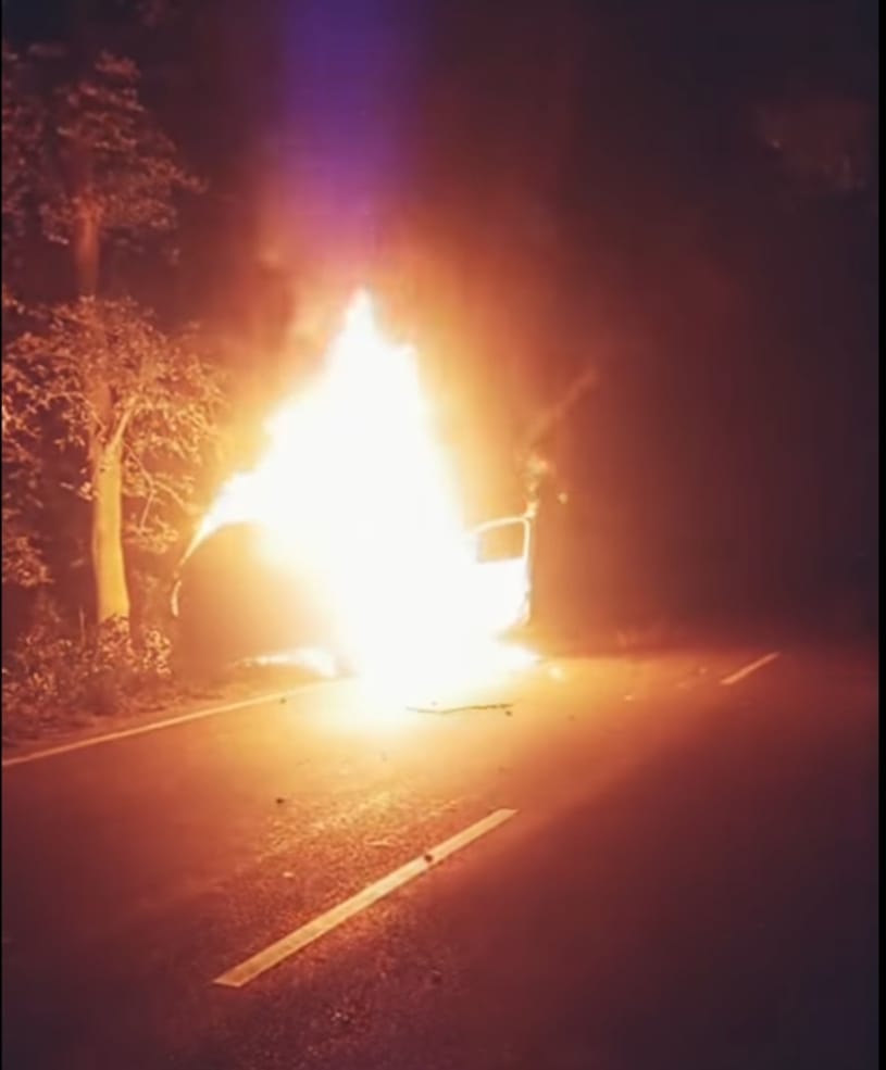 A car running on the road caught fire