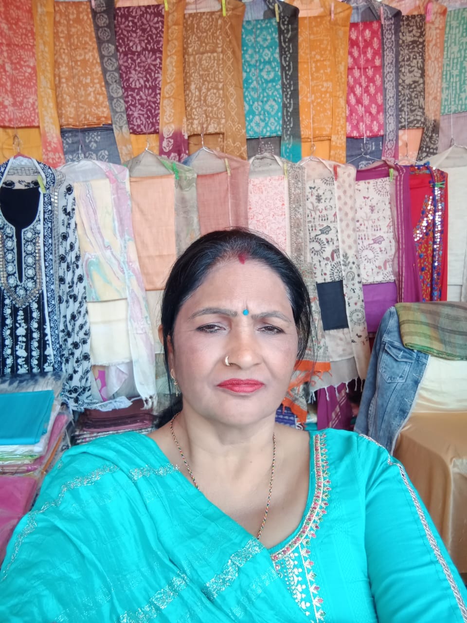 Women are creating identity by embroidering and doing phulkari on clothes with the help of needle and thread.