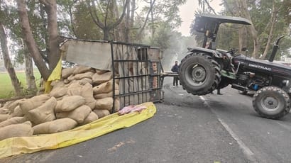 Overloaded tractor-trolley overturned on the road, causing traffic jam