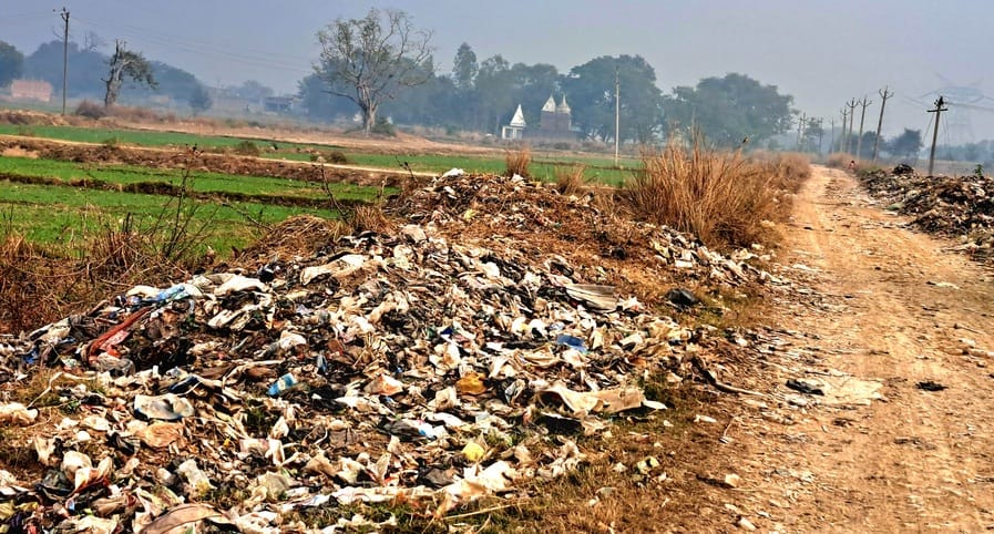 There is a risk of pollution from the pile of garbage behind Lakshmi Das Baba's hut.