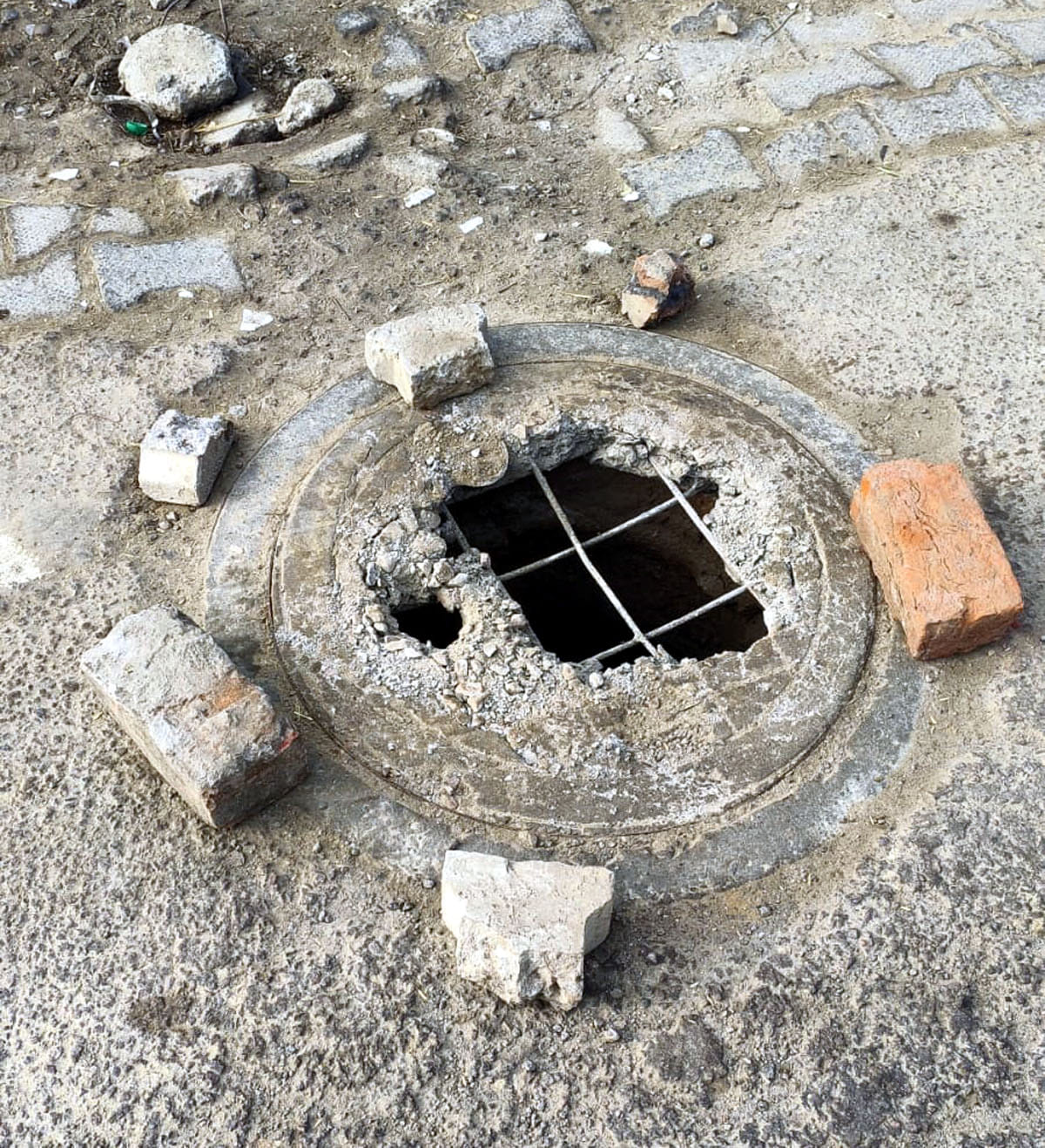 There is a possibility of accident due to sharp rods of broken sewerage cover.
