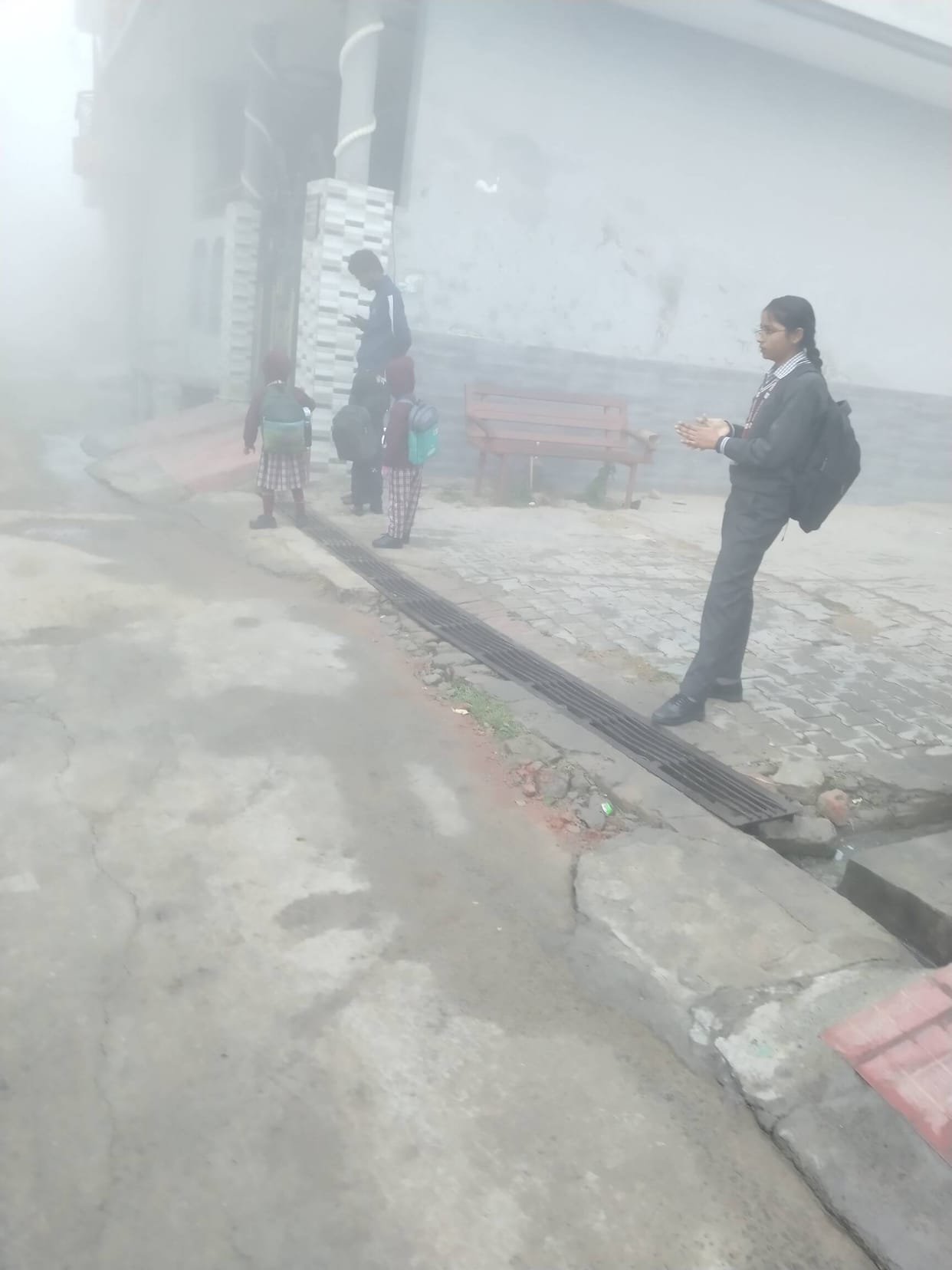 Fog enveloped the district, delaying trains by three hours, and shivering children arrived at school