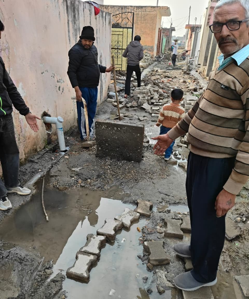The street construction was halted due to a sewer overflow