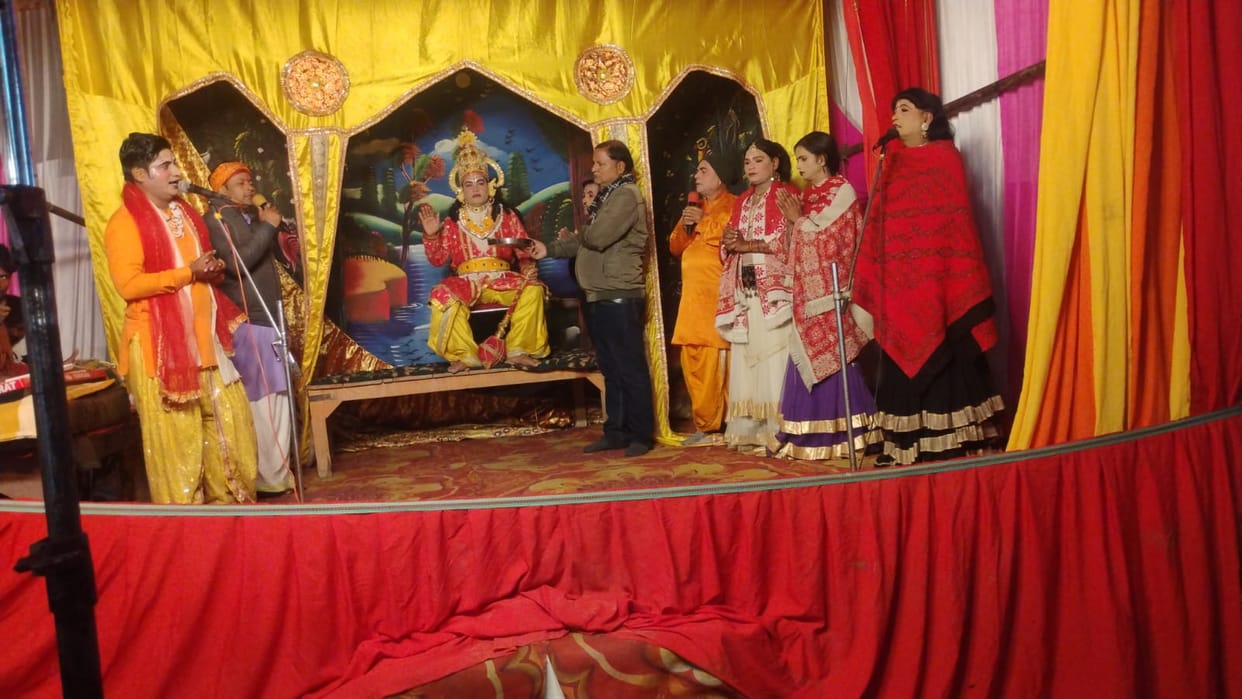 Seeing each other in the flower garden, Rama and Sita were mesmerized.