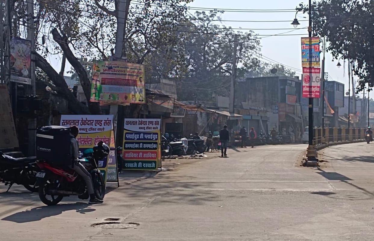 Illegal hoardings pose a risk of accidents; drivers narrowly escape danger.