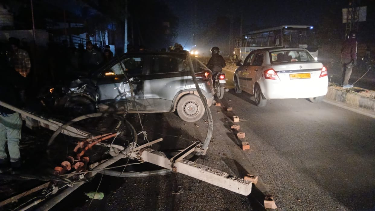 The car went out of control while trying to avoid hitting a motorcyclist, and knocked down electricity poles.