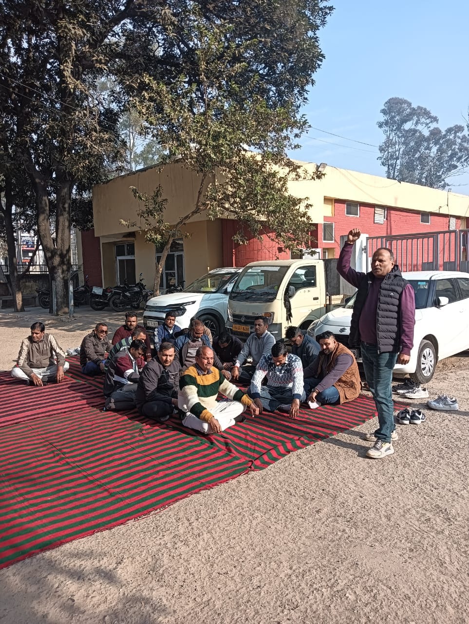 Employees staged a sit-in protest against the online transfer policy.