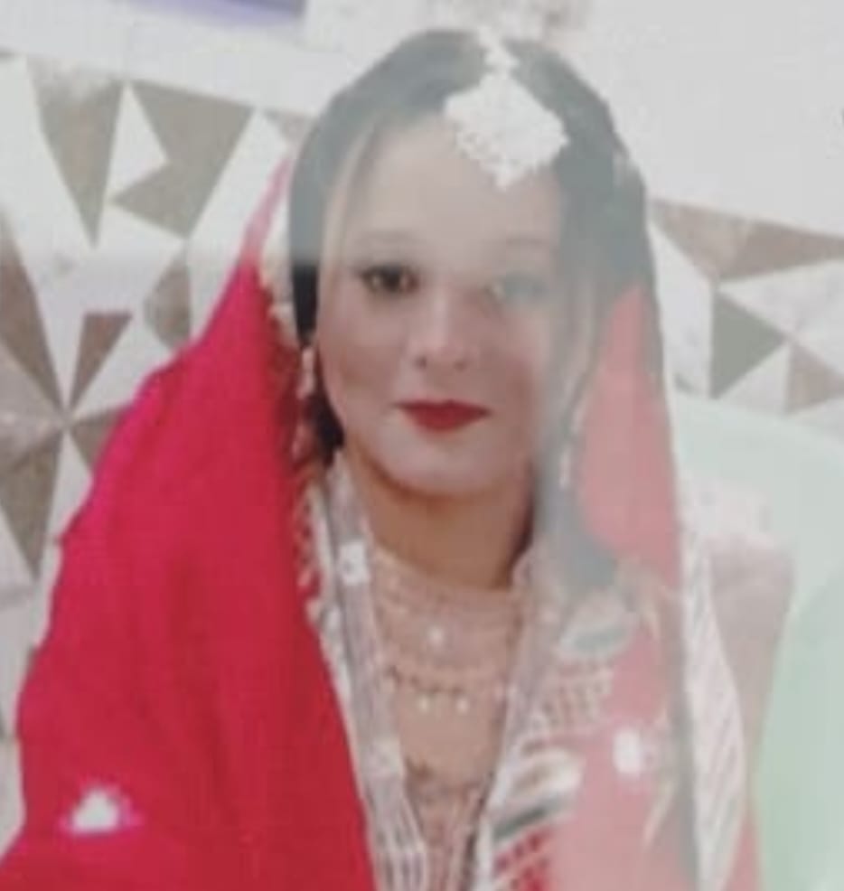 A woman riding a scooter was killed in a bus collision; her husband was injured.