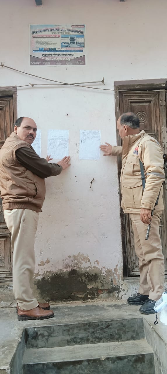 Attachment notices posted at the homes of wanted persons.