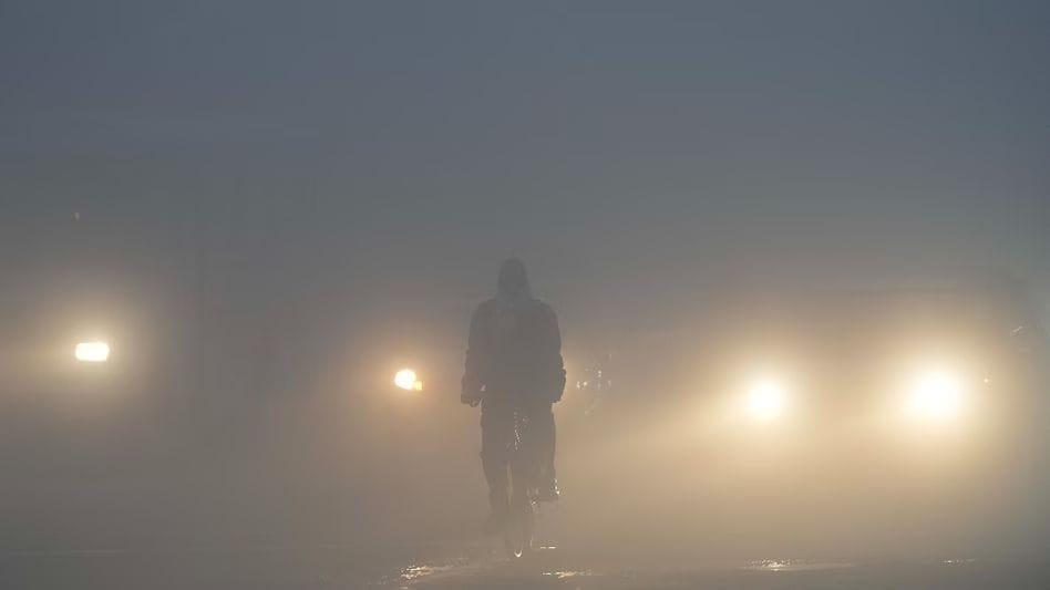 The sun was hidden in the fog, cold wave caused shivering.