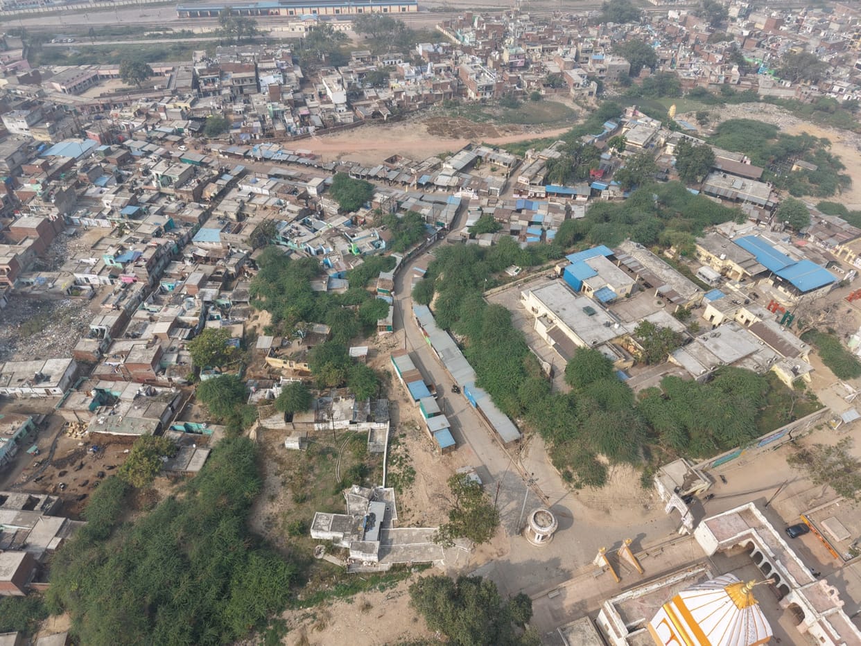 The archaeology department is calling them encroachers, while the municipality is building roads and drains for their convenience.
