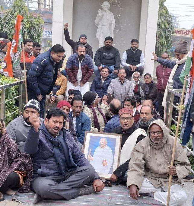 The Congress party staged a protest against the introduction of the bill for the MNREGA Act.