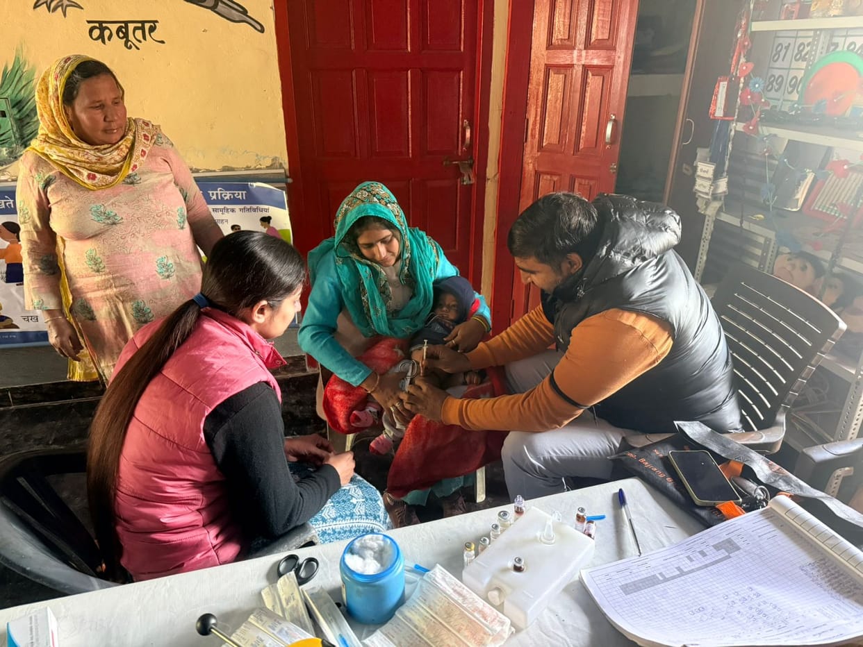 MPHW employees administered vaccinations while wearing black clothes and armbands.