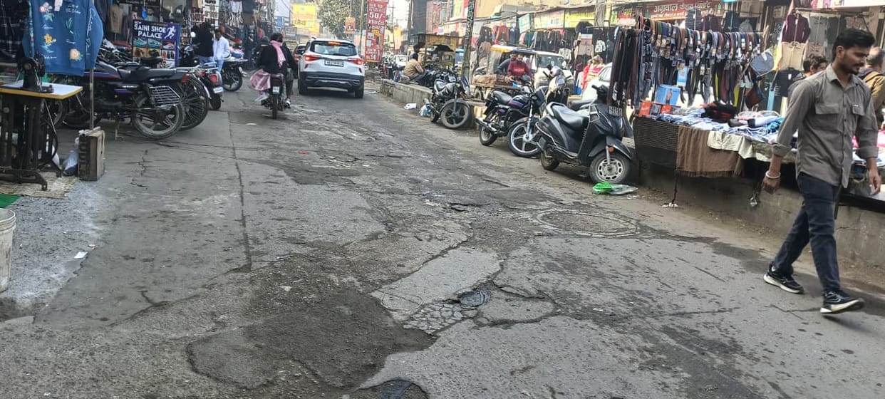 Deep potholes on the hostel road have increased the problems of motorists.