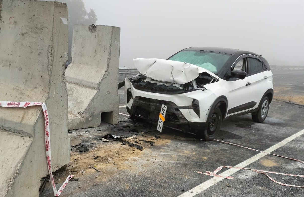 Car collides with stone placed on overbridge