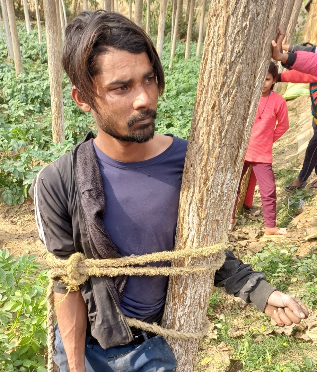 The young man accused of theft was tied to a tree and beaten.