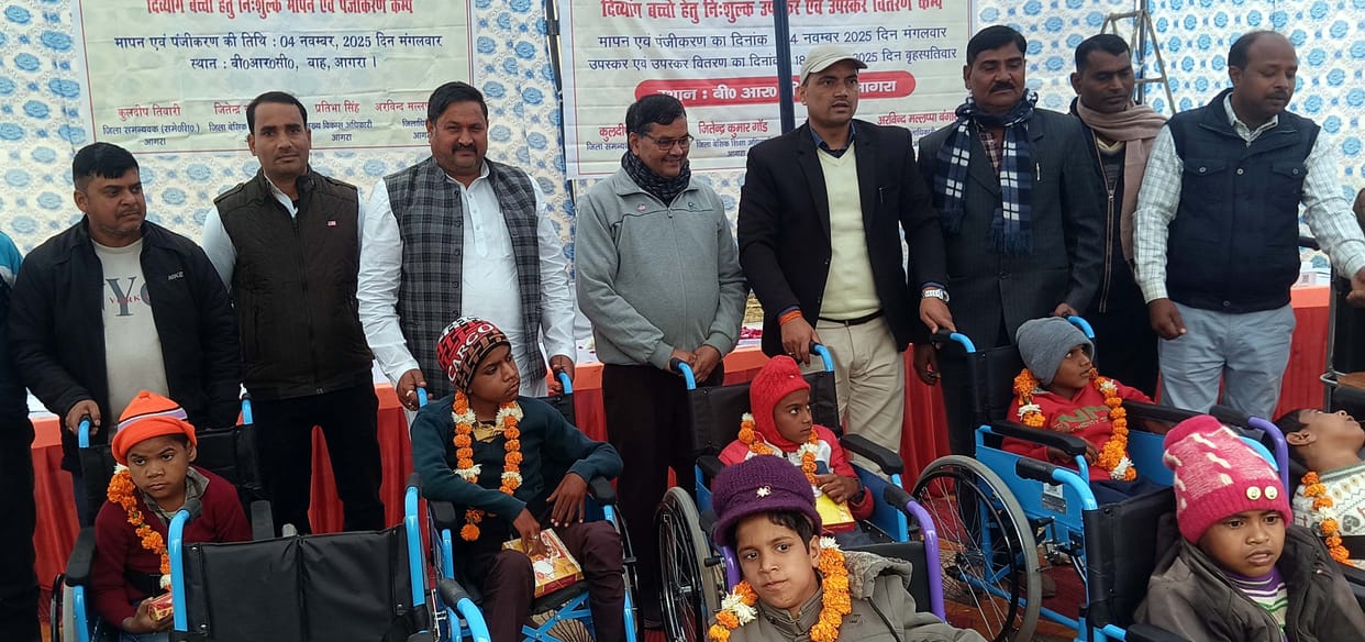 Disabled people smiled after receiving tricycle and wheelchair