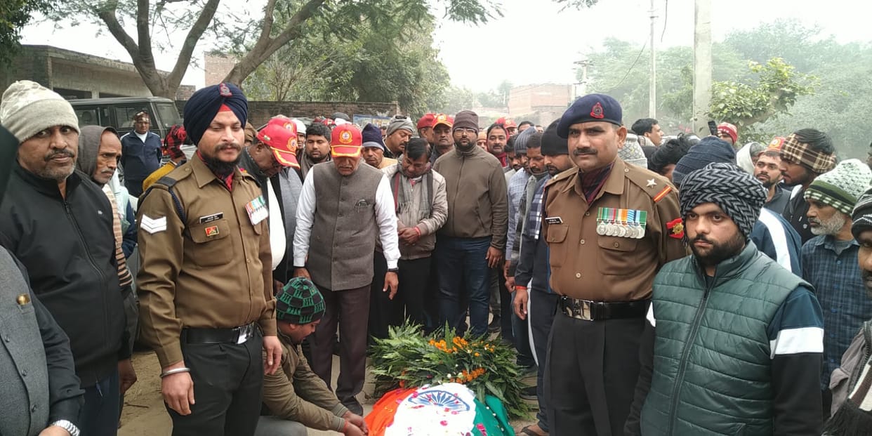 The former soldier was given a final farewell with the tricolor flag draped over him.