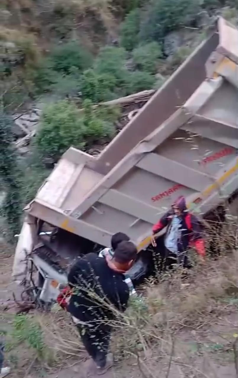 A dump truck carrying construction materials fell into a 500-foot-deep gorge, killing one person and injuring another.