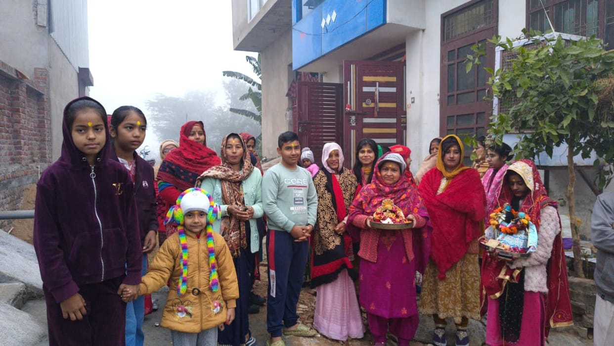 Chants of "Jai Radha Rani" echoed on Kultajpur Road.