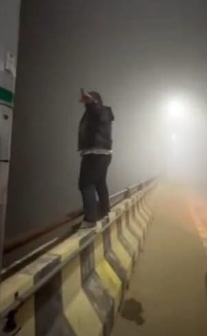 A reel was made with people dancing while standing on the bridge railing and on a car.