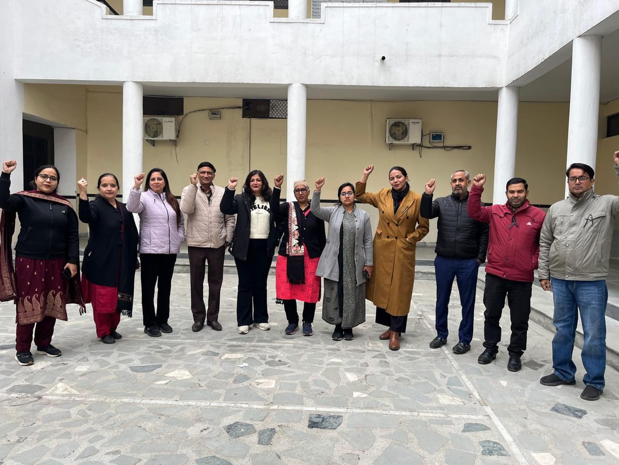 Teachers and staff members staged a protest by wearing black armbands