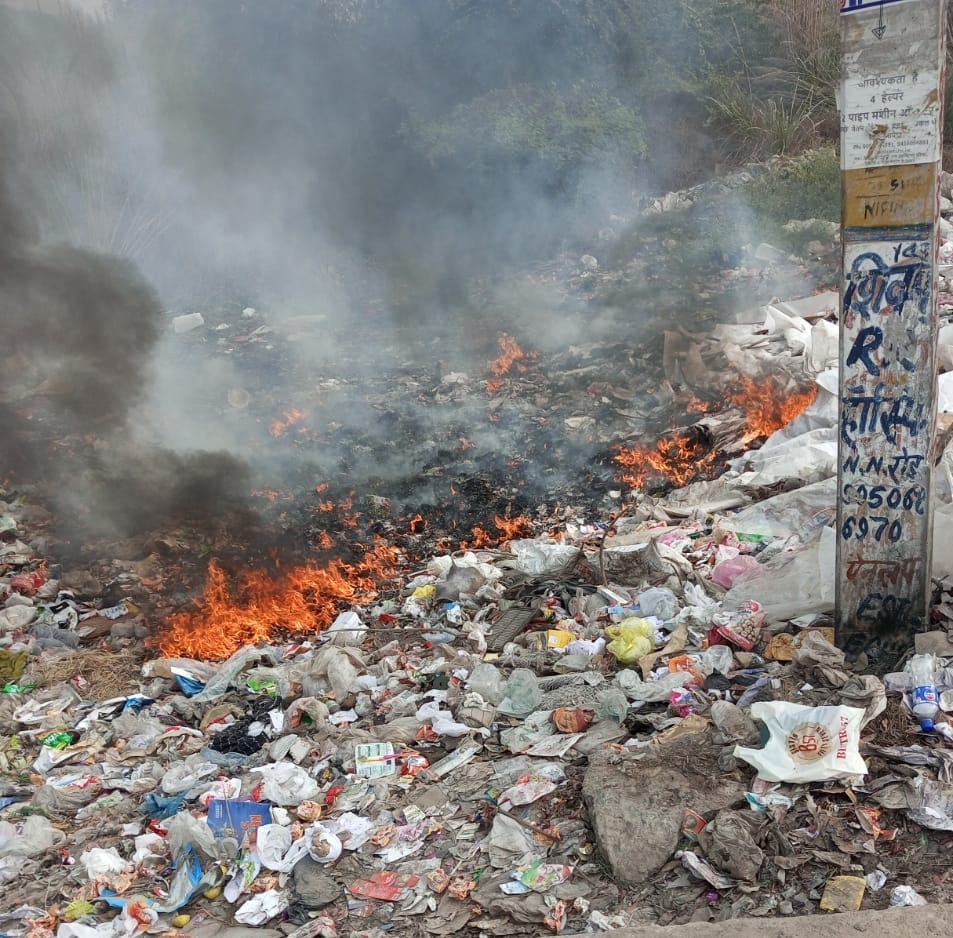 Despite claims of controlling pollution, garbage is being burned, and people are struggling to breathe.