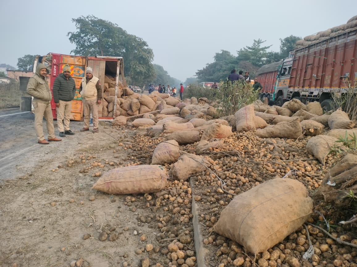 Potato laden truck overturns on highway, driver and helper injured