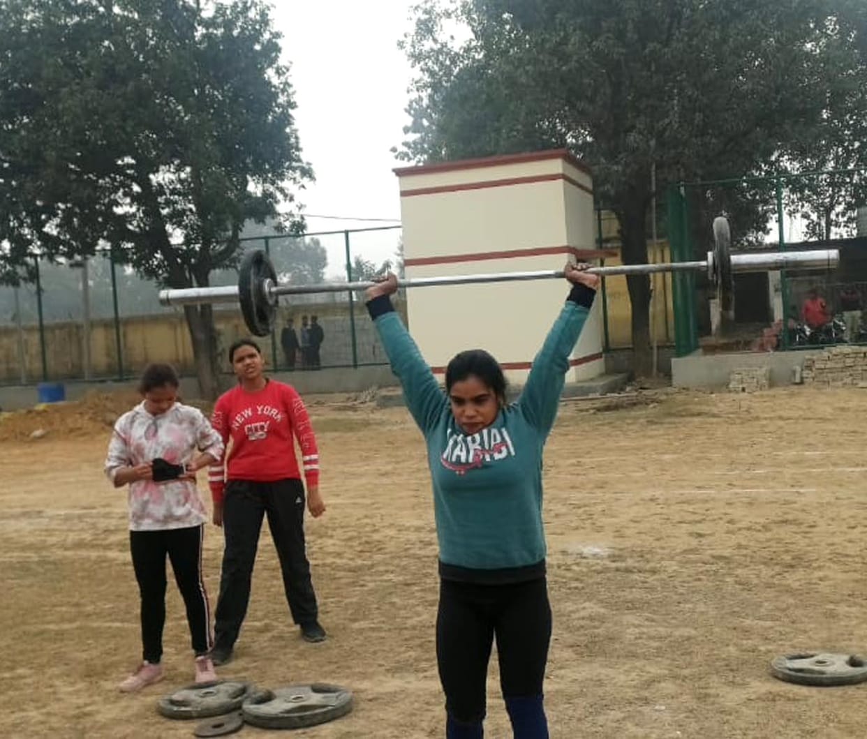 Girls participated in the weightlifting competition.