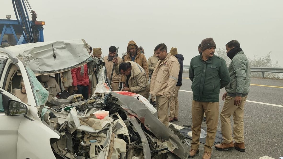 Three people died when a car collided with a parked truck on the Purvanchal Expressway in fog.