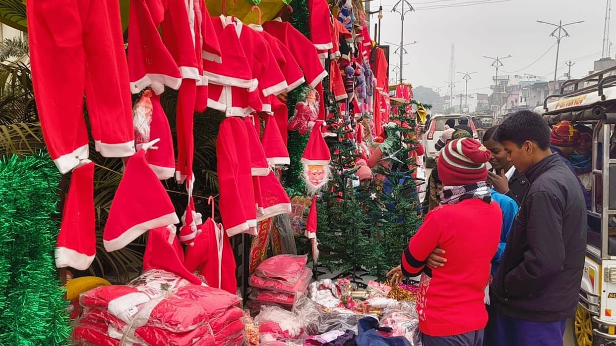 The market is buzzing with activity before Christmas, with Santa dresses selling like hot cakes.