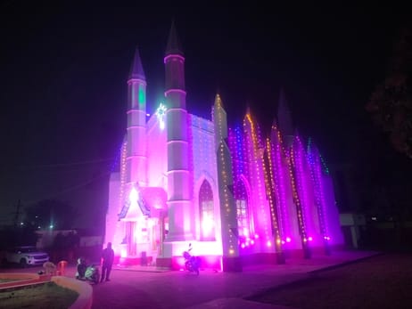 Christmas celebrations, churches lit up with colorful lights, and prayers held at midnight