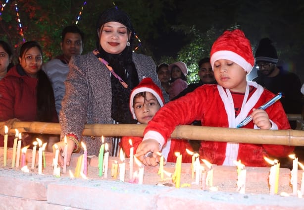 Candles were lit and prayers were offered to Lord Jesus Christ for happiness and prosperity.
