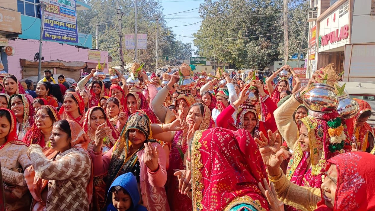 A grand procession with beautifully decorated pots was taken out, featuring a stunning tableau of Radha and Krishna.