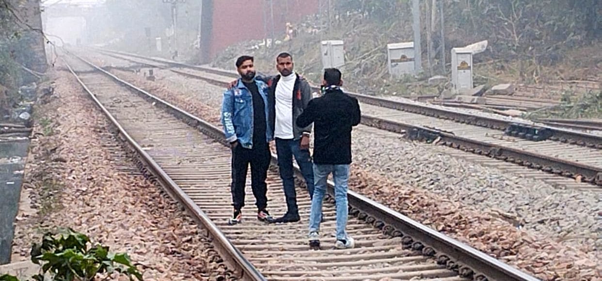 We won't give up... we are crossing the railway tracks, risking our lives.