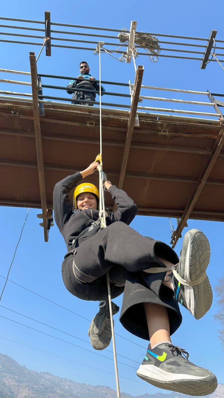 Young people learning to climb using ropes