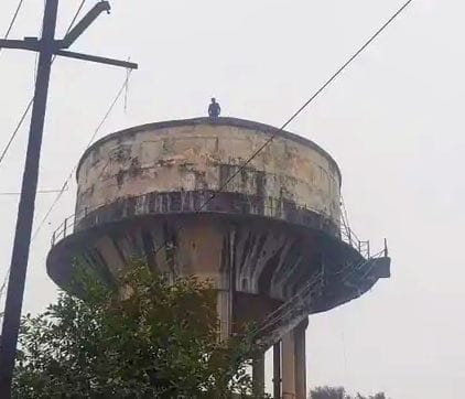 Young man created ruckus by climbing on water tank