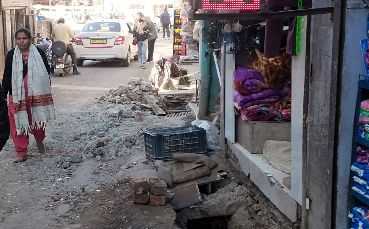 Traders from Dharampur-Subathu Road broke the concrete from the drains themselves.