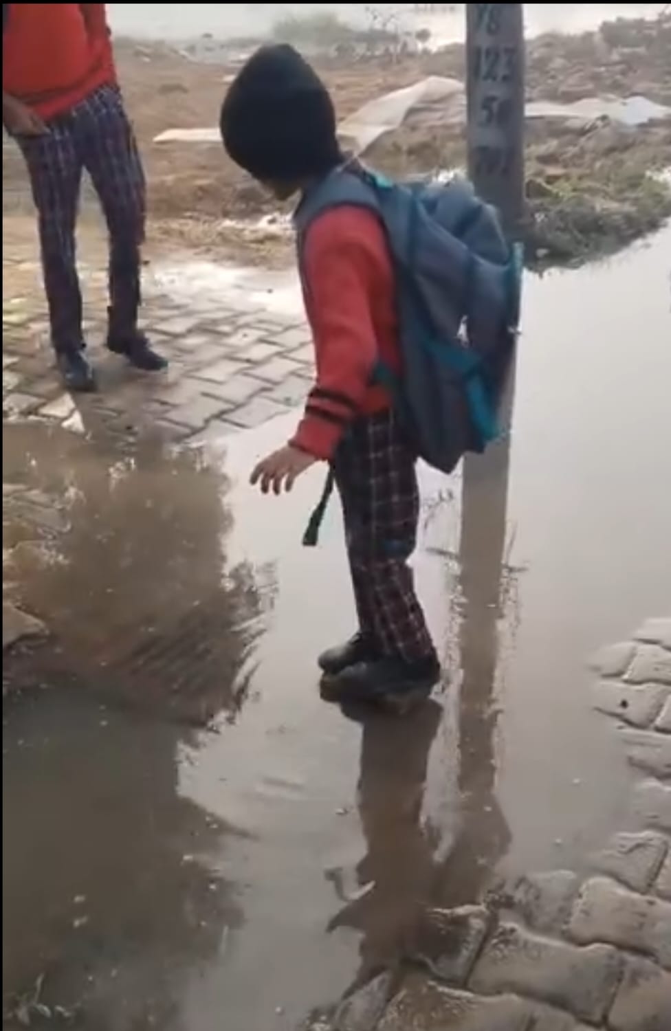 Sewerage project awaits CM's signature, children wade through contaminated water