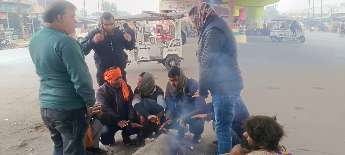 People shivered in the biting cold, finding solace in bonfires.