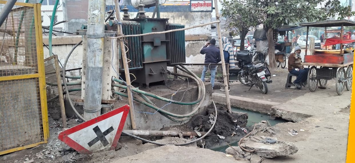 Electric transformers lying open along the highway, increasing the risk