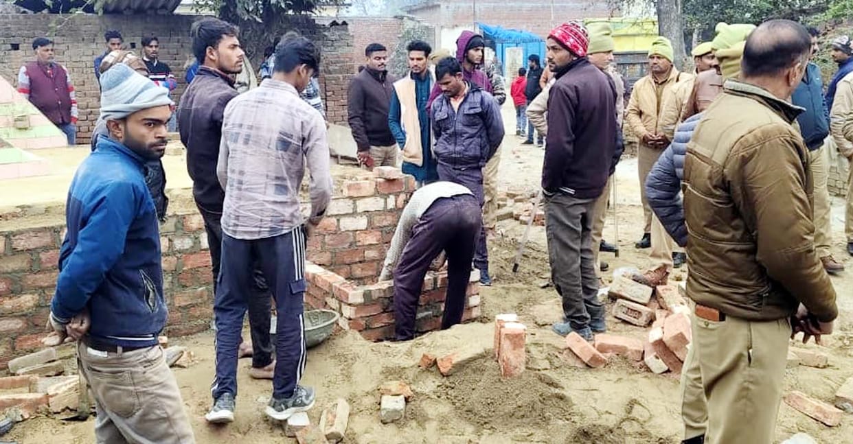 The structure that was built on the platform of the shrine a year ago was demolished using a JCB.