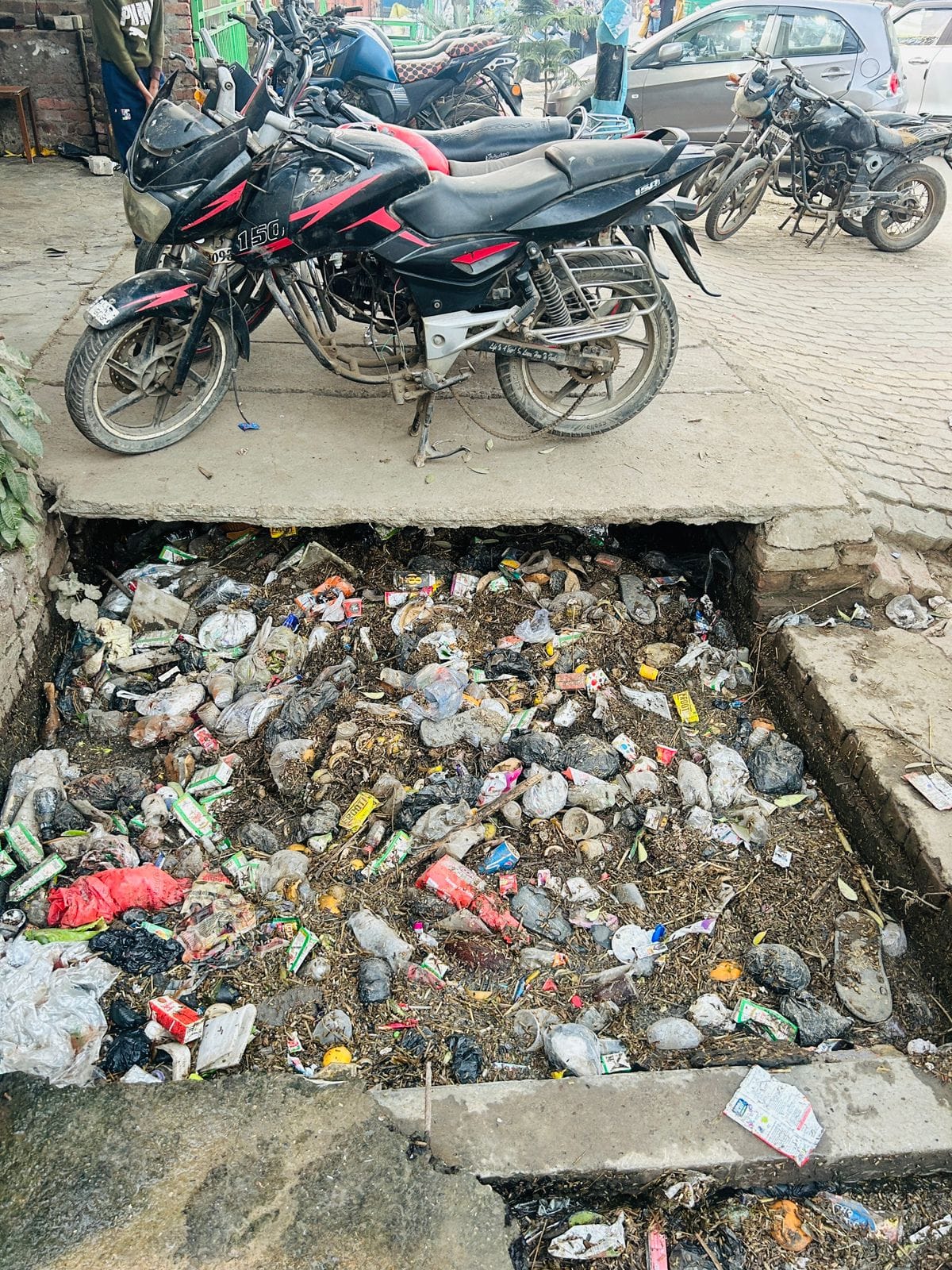 Shopkeepers worried about drain filled with dirt on Binauli Road