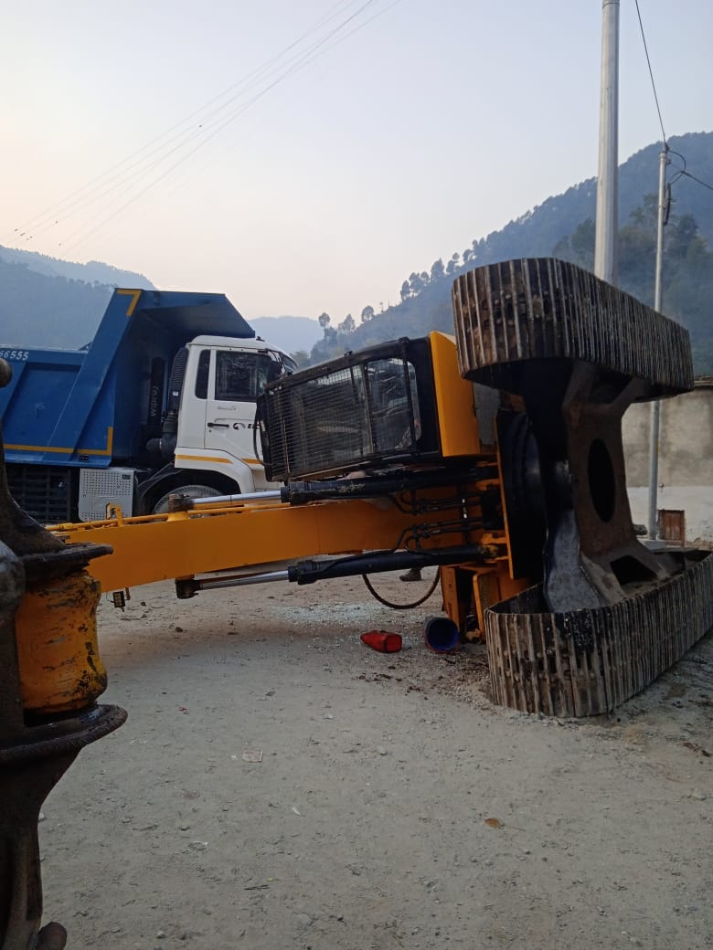 JCB overturned on the road, traffic blocked