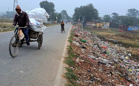 The garbage piled up along the roadside is causing increasing problems for pedestrians.