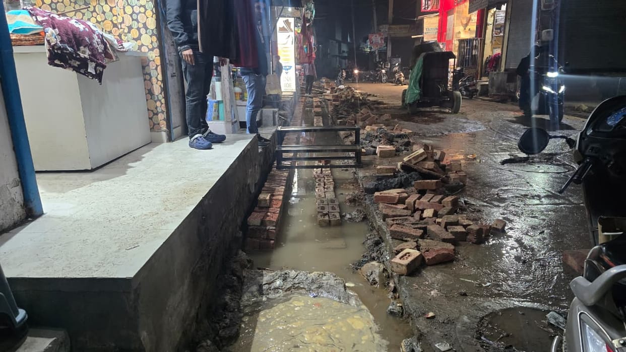 Drains were built outside the shops in the main market, and after half an hour, the tap water started accumulating.