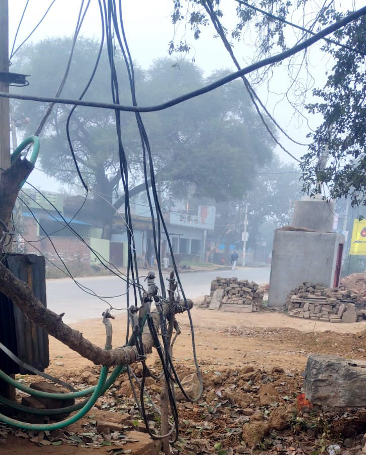 Uncovered transformer on the roadside, risk of accident in fog